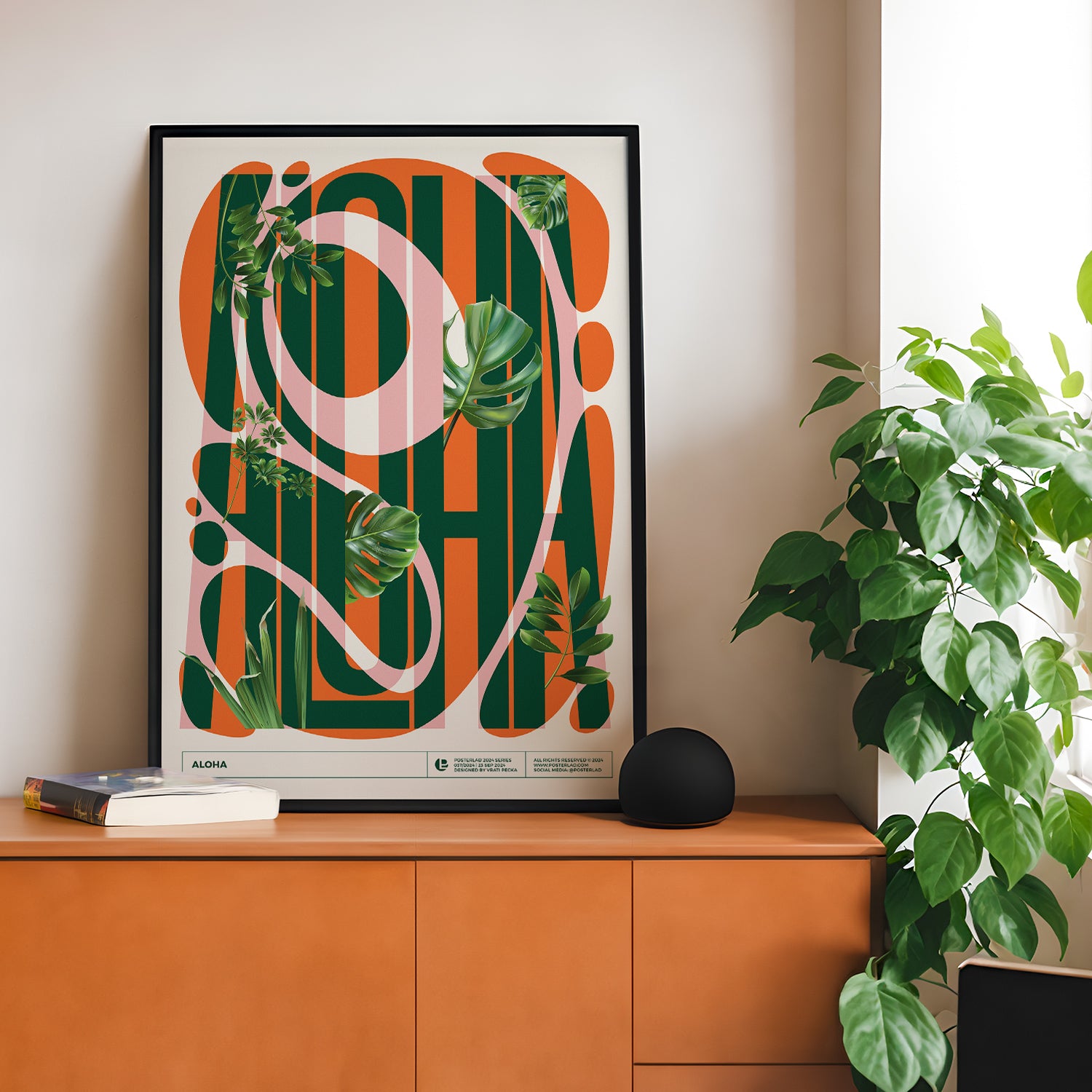 Bold ALOHA poster featuring uppercase dark green striped text over a bright orange vertically striped background with intertwined tropical green monstera and palm fronds, blending modern graphic design with vibrant tropical motifs