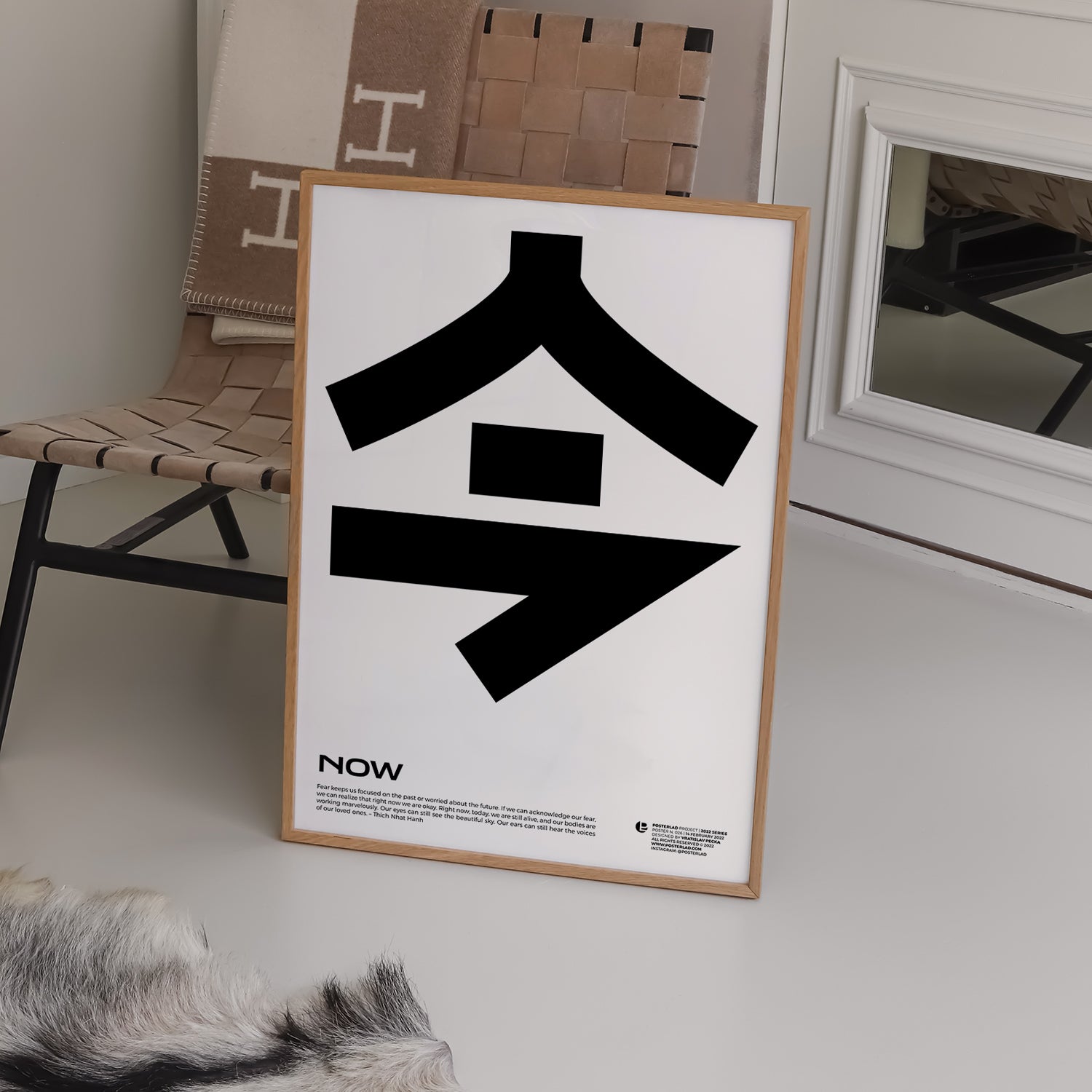 Minimalist black-and-white poster featuring a bold Japanese kanji symbol and the word NOW with a Thich Nhat Hanh quote about mindfulness and living in the present moment