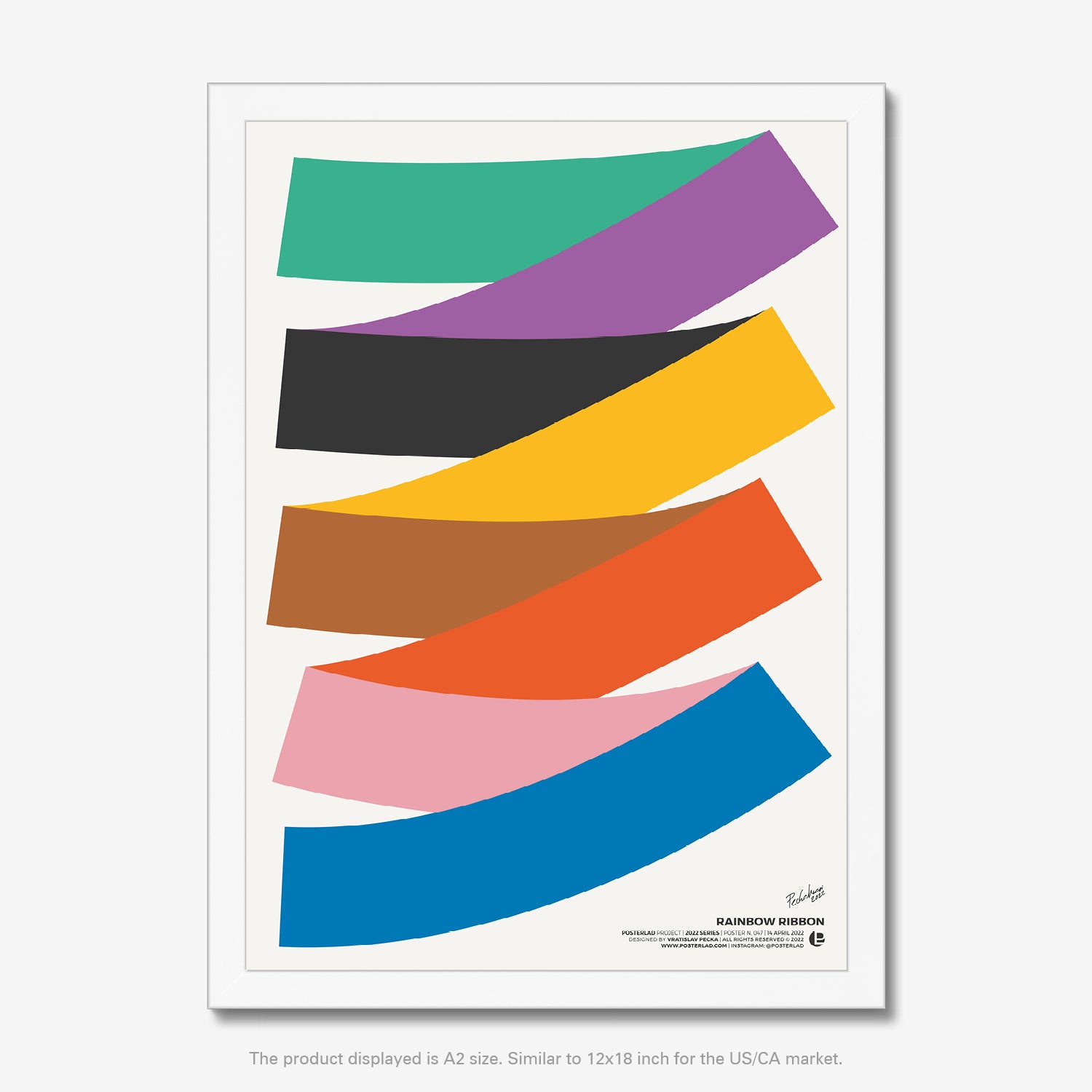Colorful rainbow ribbon wrapped around a white spool with bright, vibrant hues