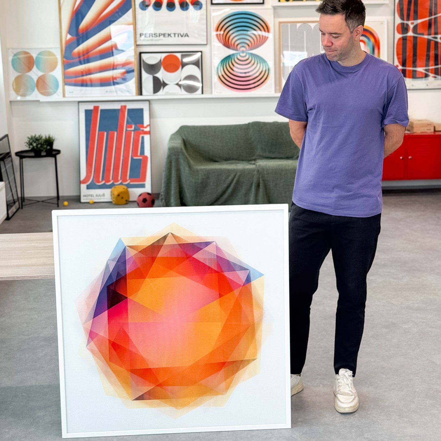 Hexagons 1/1 Edition poster showing a centered glowing sun with shifting light rays in a white wooden frame